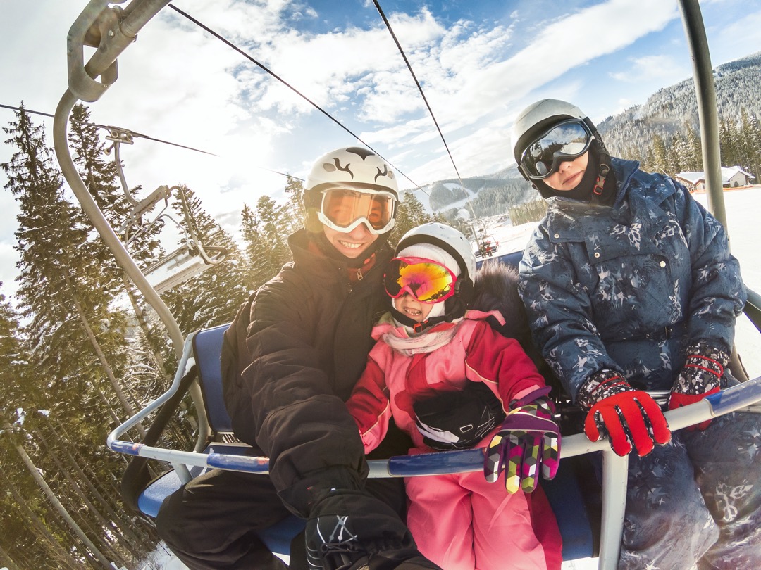 Family on ski chair lift