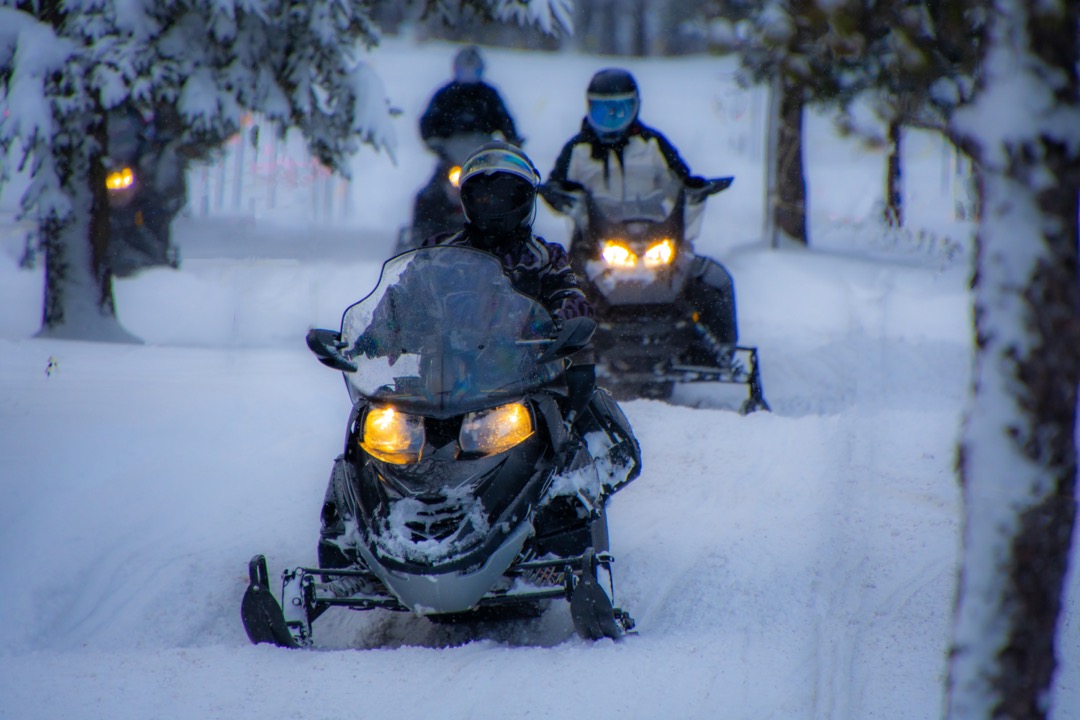 Group of snowmobilers in winter